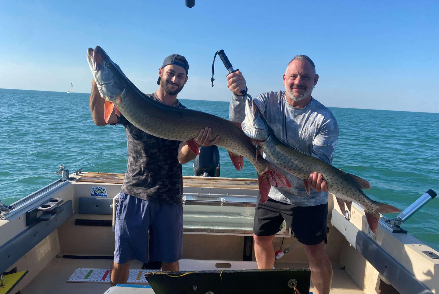 Reaper Musky Charters Two men holding their musky caught on Lake St Clair