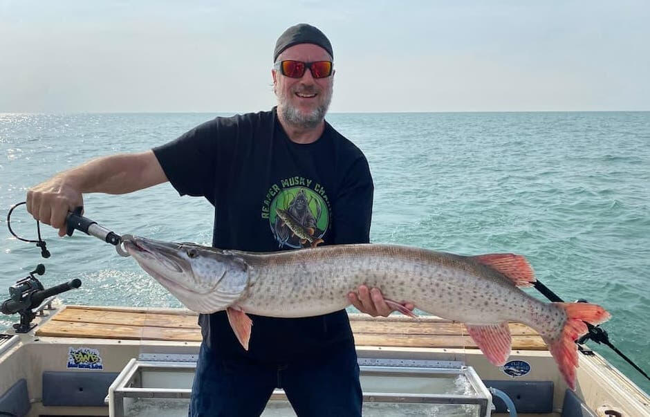 Huge catch Guest showing off a big musky caught on a Lake St. Clair guided fishing trip